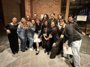 Belinda Boyd, coordinator of the BFA acting program at UCF, poses for a photo with a group of UCF theatre students. 