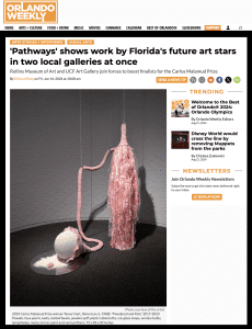 screen shot of a news article with a large pink art installation pictured