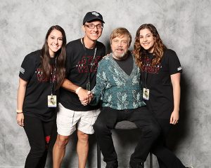 Peter Telep (second from the left) posing with actor Mark Hamill at Star Wars Celebration 2017.