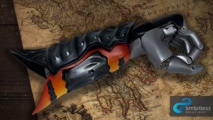 Orange and silver painted 3D prosthetic arm made in collaboration with Limbitless Solutions and Assassin's Creed Odyssey