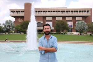 Haidar Khezri, UCF's first assistant professor of Arabic, in front of the Reflecting Pond
