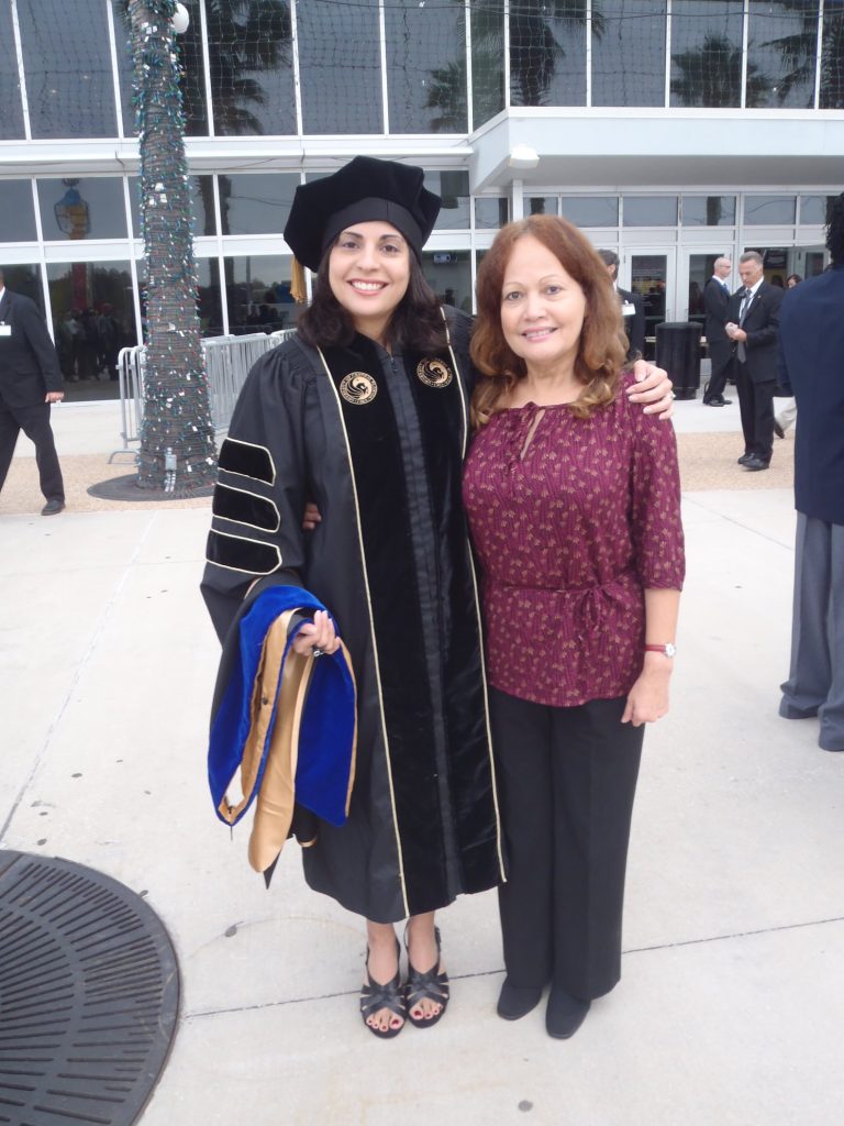 Stacey DiLiberto poses with her mother at her Ph.D. graduation ceremony