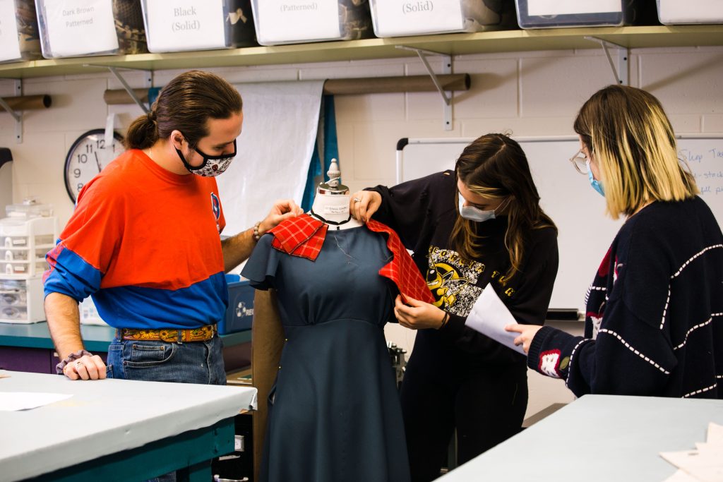 Theatre UCF students Aidan McDonnell, Katherine Polgar and Kacie Bailey hard at work creating one of the many costumes for The Resistible Rise of Arturo Ui.