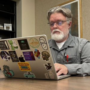 Jason Burrell on laptop