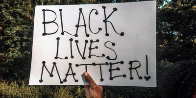 Hand holds Black Lives Matter sign