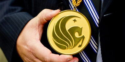 Closeup of ribbon and medallion with UCF pegasus logo