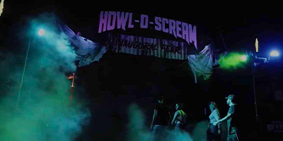 Fog-shrouded gates to Howl-O-Scream attraction