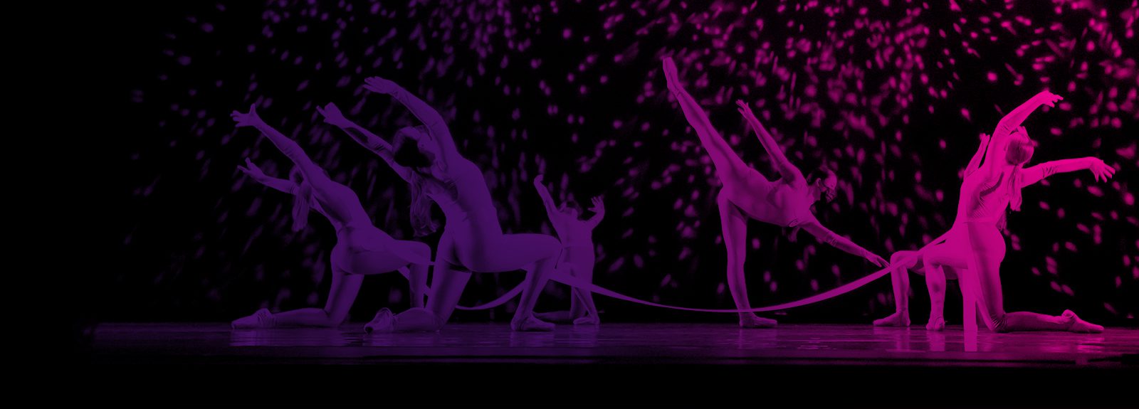Student dancers perform with ribbons and sparks