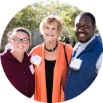 Donor poses with two scholarship winners