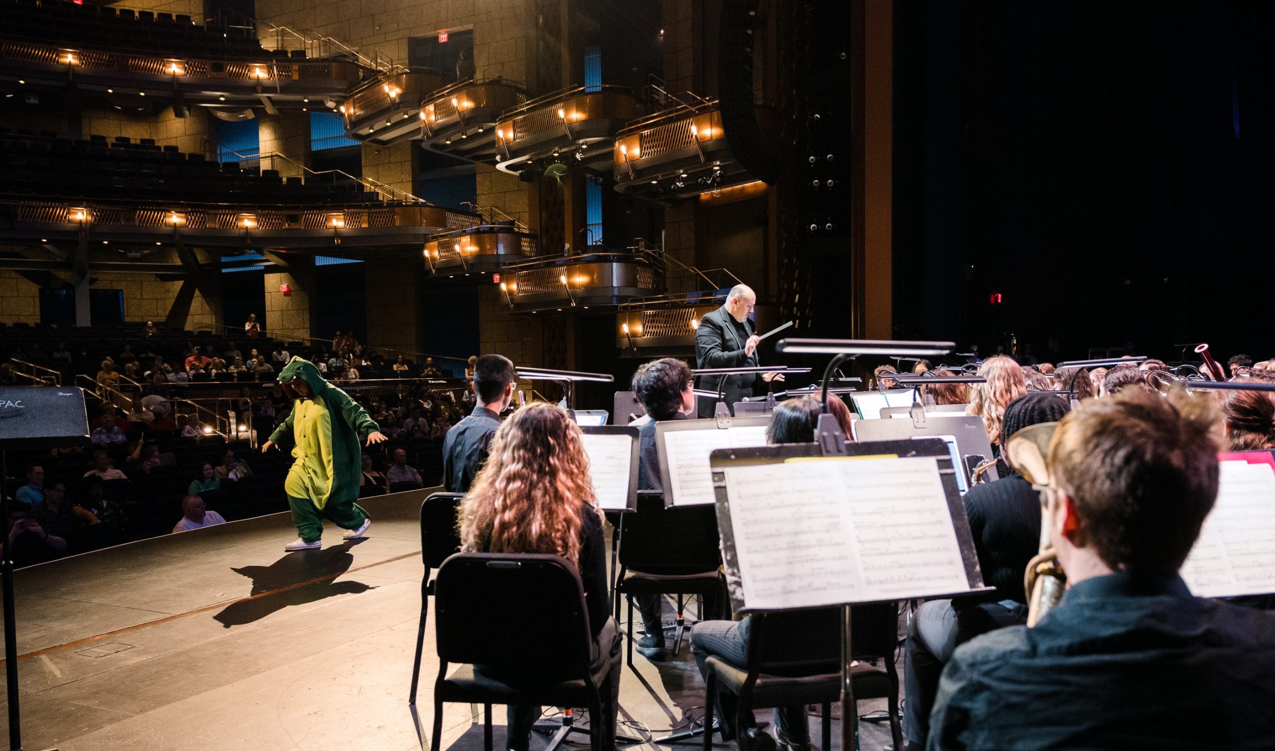 Instrumentalists perform on stage at Walt Disney Theater