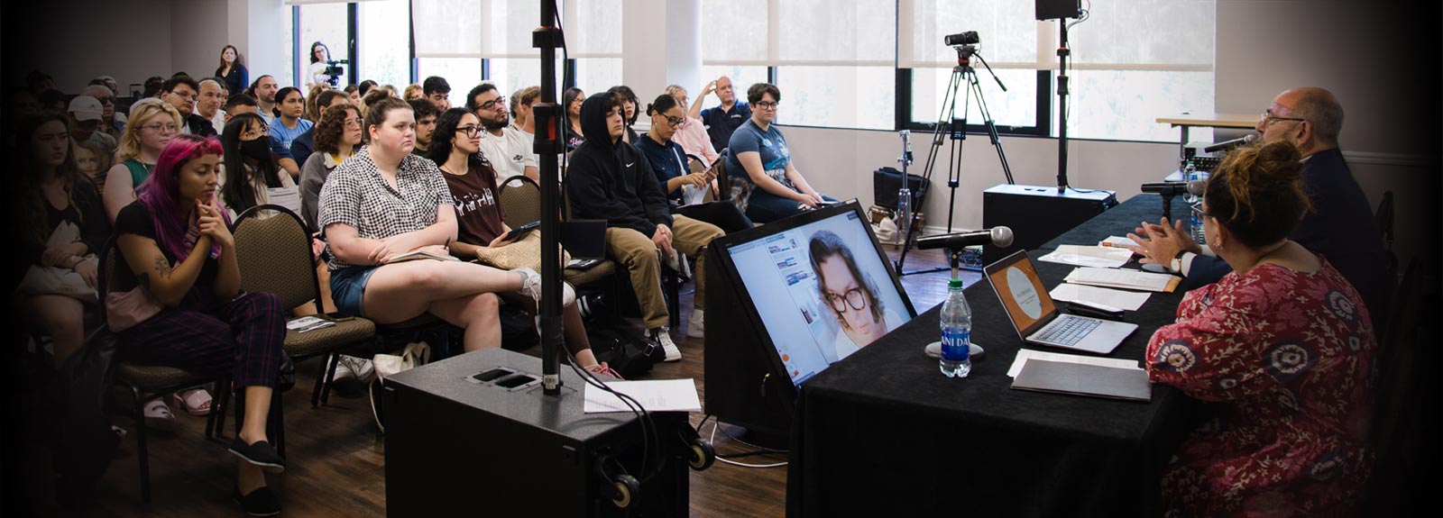 Students attend panel lecture with live and remote guests