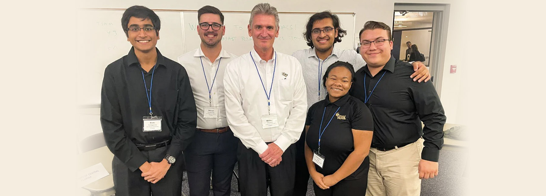 The UCF Ethics Bowl team poses with their coach, Professor Michael Strawser