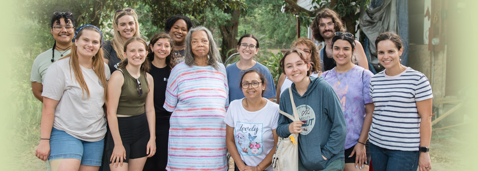 Students, faculty and community members pose during a service learning event