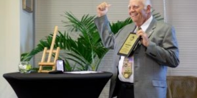 Photo of Dr. Neil Euliano receiving an award