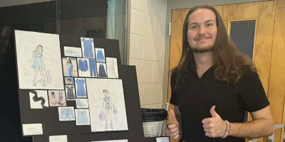 Photo of UCF Theatre student Adian McDonell with his concept designs