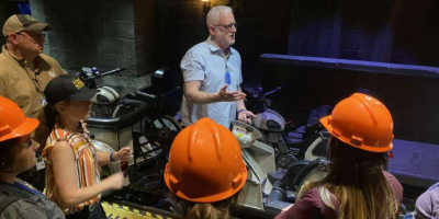 Photo of students taking a tour of the thrill ride Hagrid's Magical Motorbike Adventure