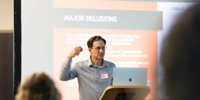 graduate faculty Barry Mauer speaking