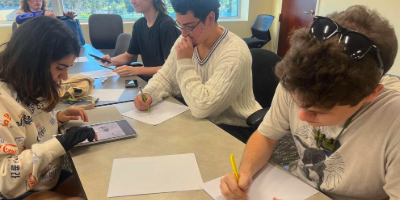 Art Club at UCF members engage with the costume-figure drawing activity