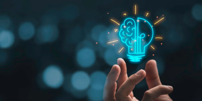 Hand grabbing a holographic lightbulb