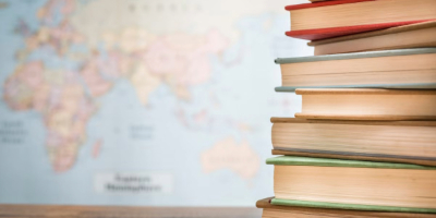 Books in front of World map