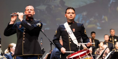 Musicians in Marine uniforms perform on stage