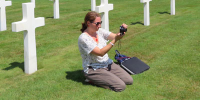Amelia Lyons takes photos in cemetery