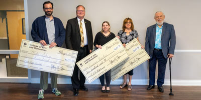 CAH staff award winners pose with dean and donor