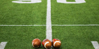 Footballs lay on American football field