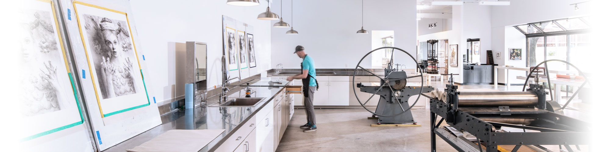 Artist works in Flying Horse Editions' printmaking studio