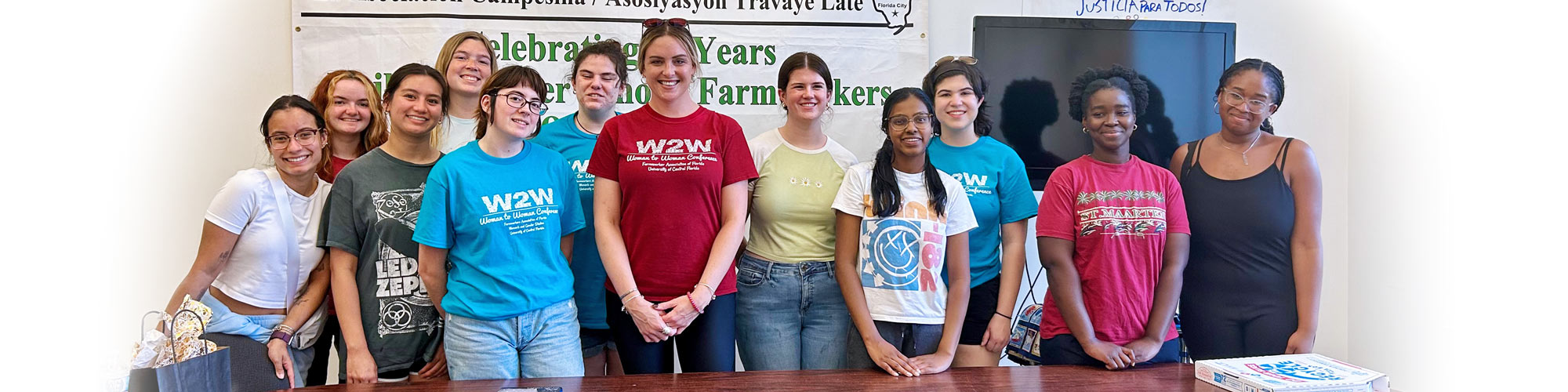 Students and faculty pose at an event for the Farmworkers Association of Florida