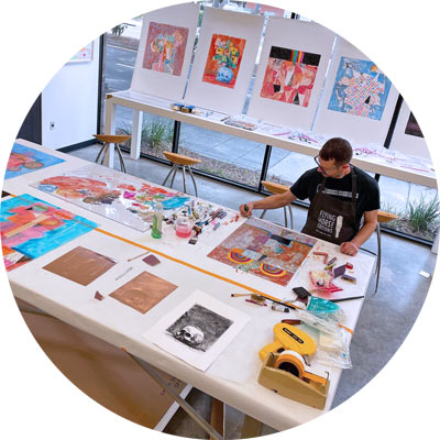 Artist works on colorful print
