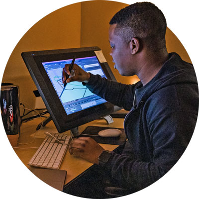 Student animator works at monitor
