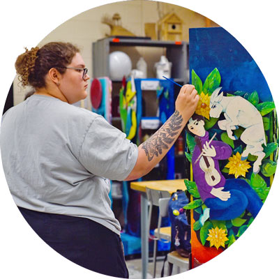 Student paints in studio