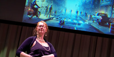 Student in front of projection screen with AI-generated image