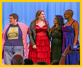 Students share congratulations on stage