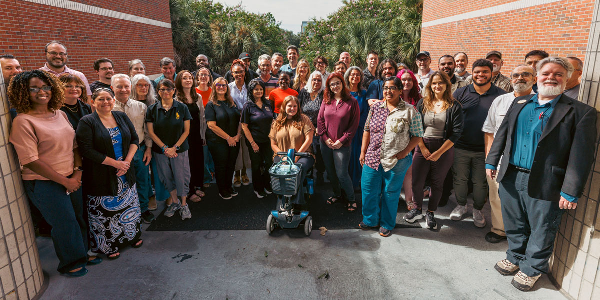 Faculty and staff members in the UCF School of Visual Arts and Design pose together.