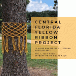 yellow ribbon knotted around a tree to raise awareness of veteran homelessness