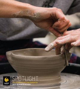 Magazine cover with hands forming clay bowl