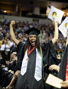 Excited student in graduation attire