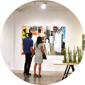 a couple looking at artwork